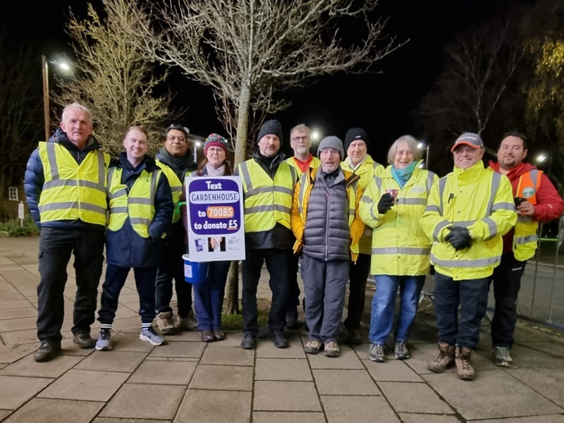 a-team-of-volunteers-wearing-hi-vis-clothing-at-the-farmers-on-christmas-lights-tour