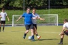 two-footballers-challenging-for-the-ball