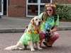 woman-and-golden-retriever-wear-matching-t-shirts-and-flowers