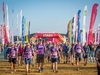 participants-walking-toward-camera-with-start-line-behind-them-at-the-jurassic-coast-ultra-challenge