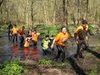 muddy-mayhem-participants-wade-through-waist-high-mud