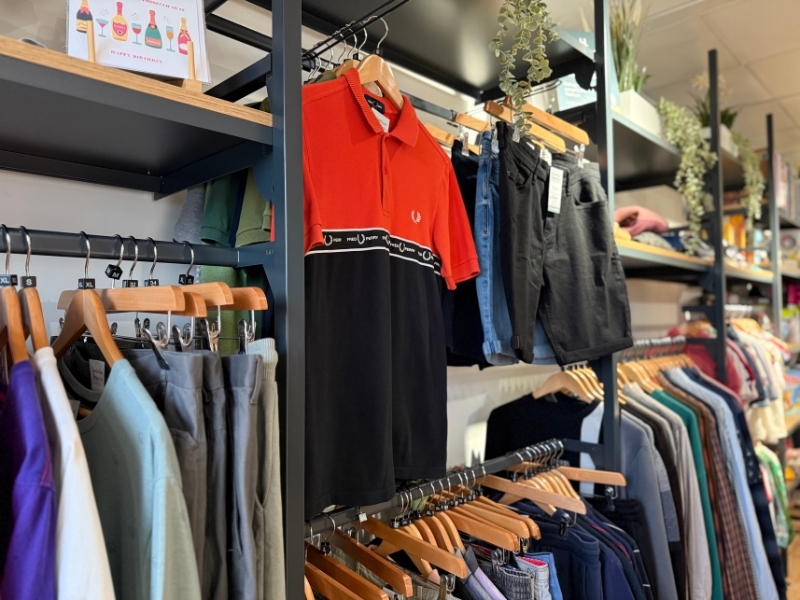 preloved-shirts-shorts-and-other-clothing-hanging-on-rails-at-our-fairfield-shop