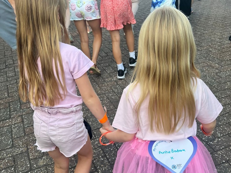 two-young-girls-hold-hands-at-sunset-starlight-walk