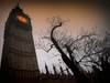 photo-looking-up-at-big-ben-edited-with-orange-lighting-on-the-london-halloween-walk