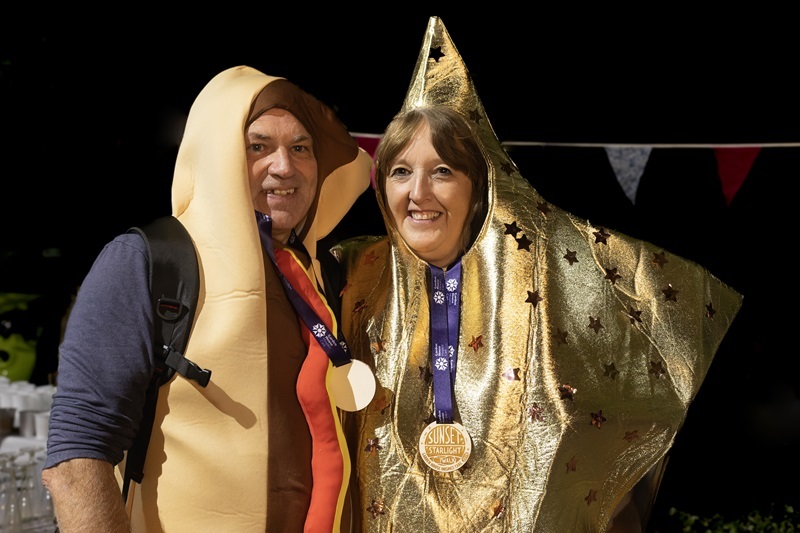 couple-dressed-as-star-and-hotdog-wearing-medals