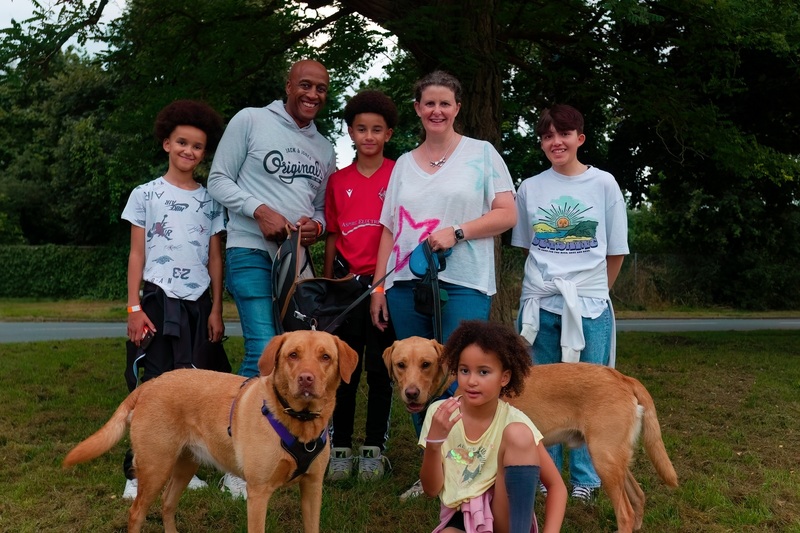 a-family-of-six-and-their-two-dogs-at-sunset-starlight-walk