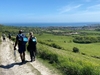 trekkers-admiring-scenic-hillside-and-coastal-views-on-the-jurassic-coast-ultra-challenge