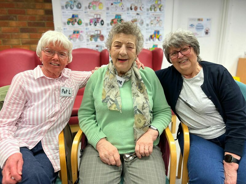 three-community-members-at-a-wellbeing-hub