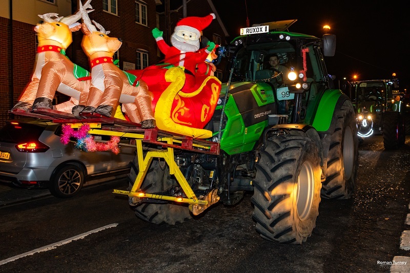 tractor-decorated-in-christmas-lights-and-inflatable-santa-and-reindeer