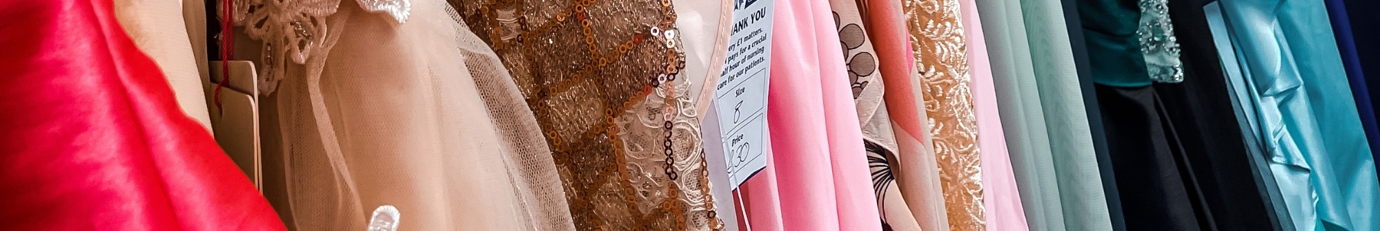 close-up-of-prom-dresses-on-a-clothes-rail