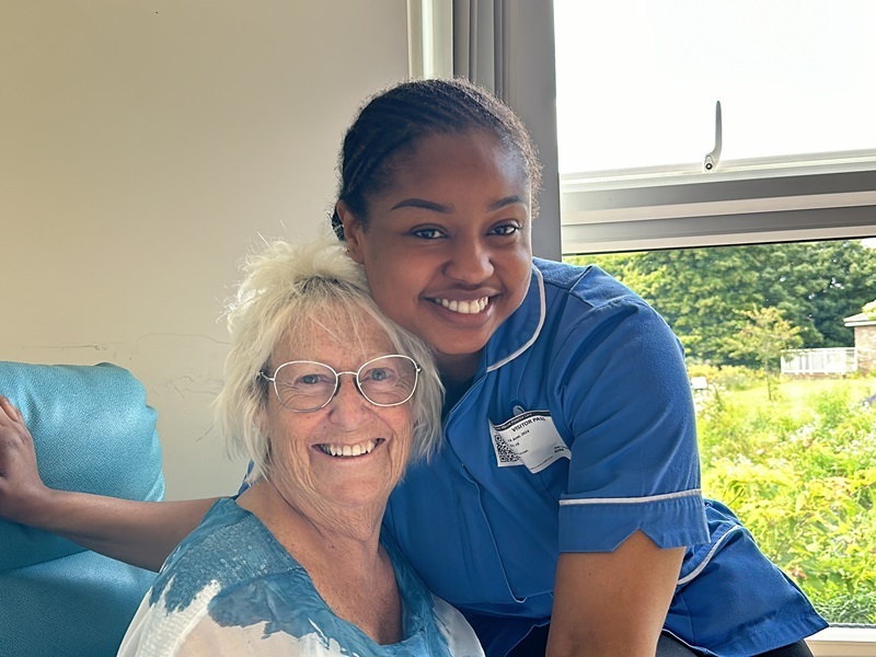 polly-smiles-with-a-nurse-on-the-inpatient-unit