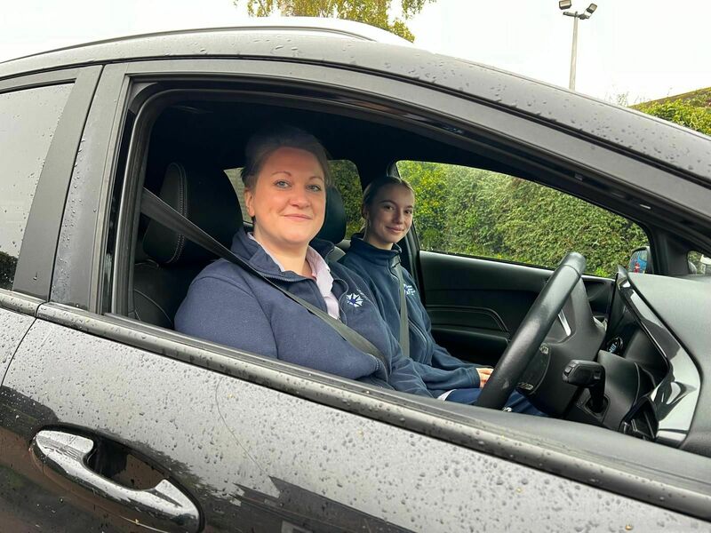two-hospice-at-home-nurses-in-the-car-smiling