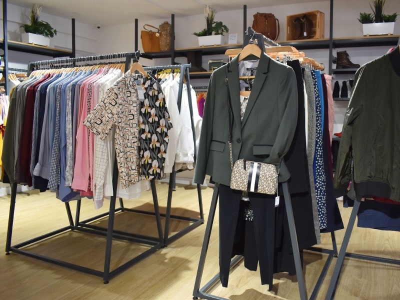 clothes-hanging-from-rails-in-the-baldock-shop