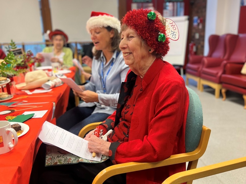 carol-smiling-at-the-wellbeing-hub-christmas-party