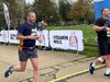 runner-crossing-finish-line-at-herts-half-10k