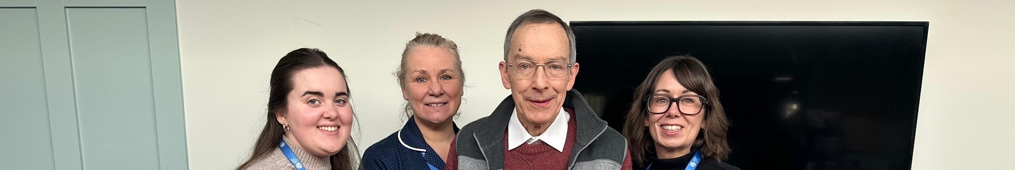 hospice-staff-stand-and-smile-with-mr-chetwin