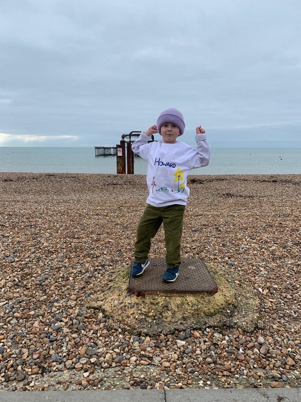 howard-standing-on-the-beach-cheering