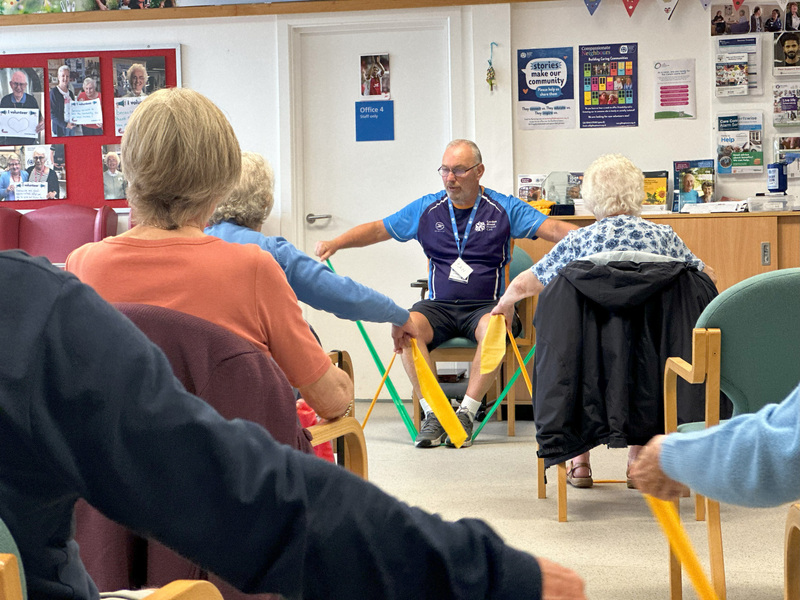 wellbeing-hub-coordinator-ian-leads-seated-exercise-session