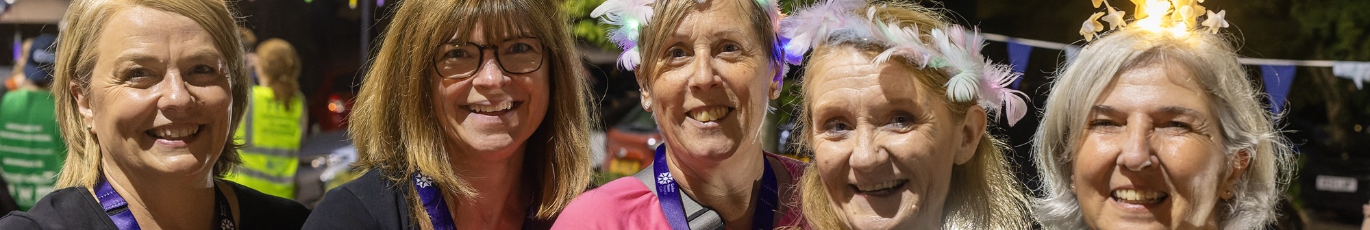 group-of-ladies-smiling-at-sunset-starlight-walk-finish-line