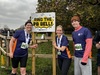 three-runners-smile-ringing-the-pb-bell