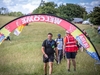 participant-crosses-through-the-welcome-line-on-the-kent-downs-50-ultra-challenge