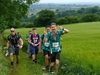 a-group-of-participants-walking-toward-the-camera-on-the-north-downs-50-ultra-challenge