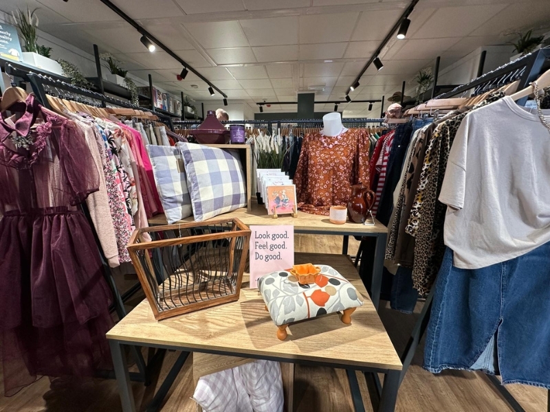 a-table-selling-accessories-surrounded-by-clothes-rails-at-our-fairfield-shop