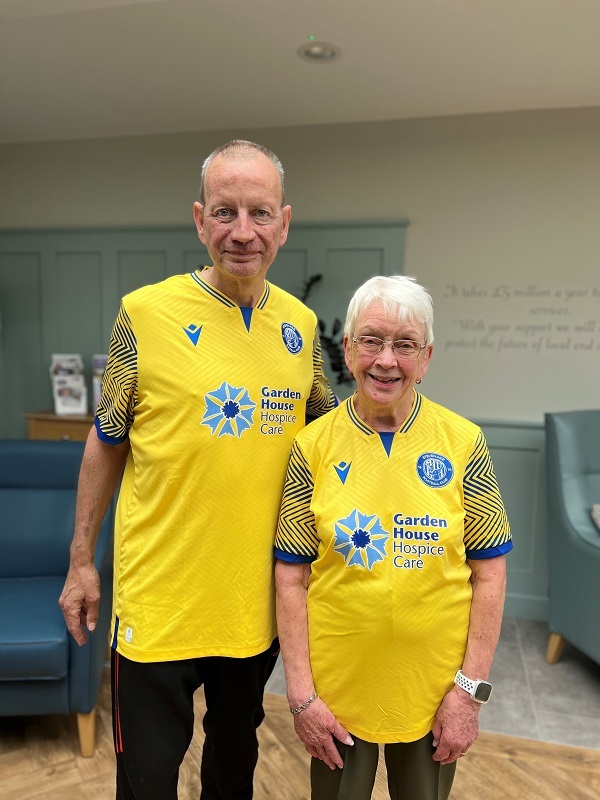 vivien-and-derek-wearing-stevenage-fc-shirts-containing-hospice-logo