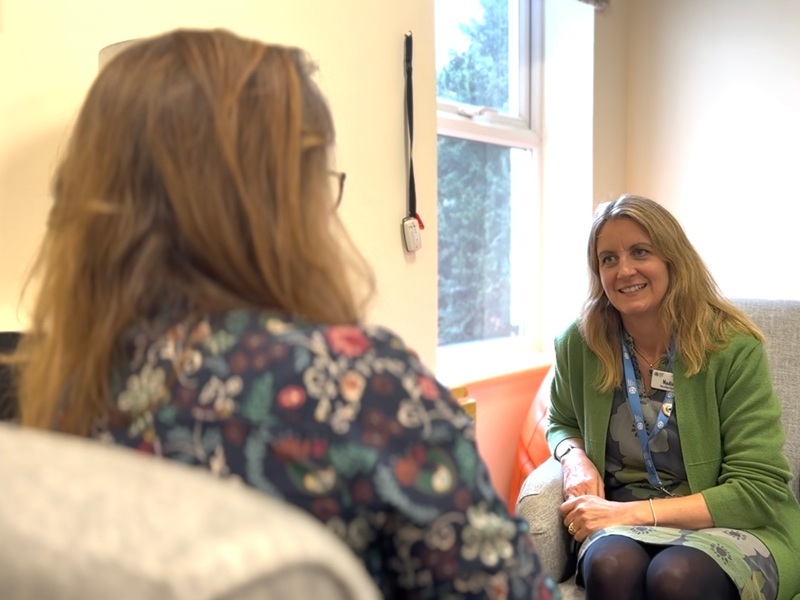 counsellor-smiling-while-talking-to-a-service-user