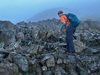 woman-hiking-through-rocky-terrain-on-national-three-peaks-challenge