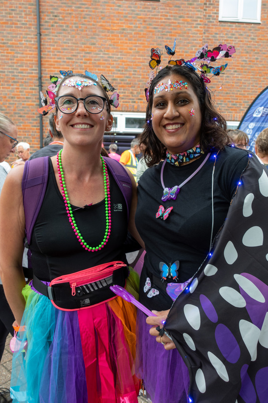 two-ladies-wearing-bright-clothing-at-sunset-starlight-walk