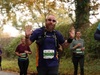 man-running-herts-10k-waves-at-camera