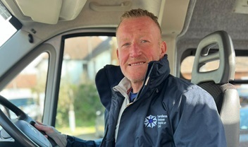 volunteer-community-driver-smiling-in-the-minibus