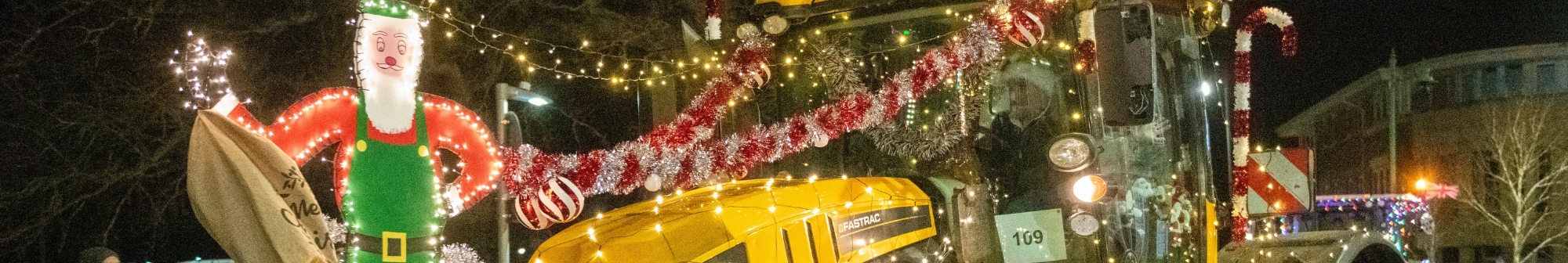 a-tractor-adorned-with-christmas-lights-and-figures