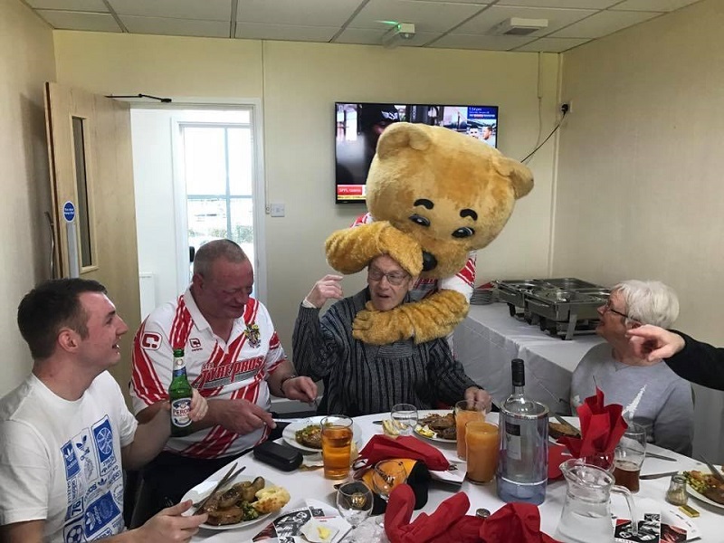 alan-is-hugged-by-stevenage-mascot-boro-the-bear