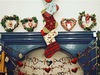 festive-wreaths-stockings-and-hanging-decorations-surround-a-fireplace