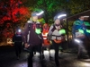 participants-wearing-glow-sticks-and-head-torches-on-the-thames-moonlight-walk