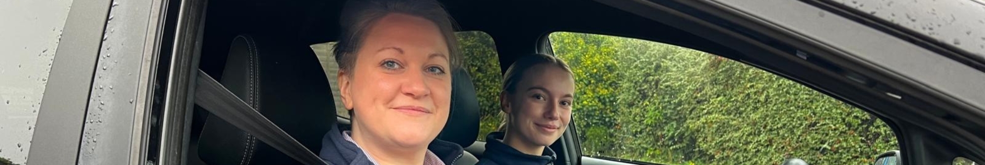 two-hospice-at-home-nurses-in-the-car-smiling