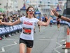 runner-smiles-and-high-fives-crowd-member-at-brighton-marathon