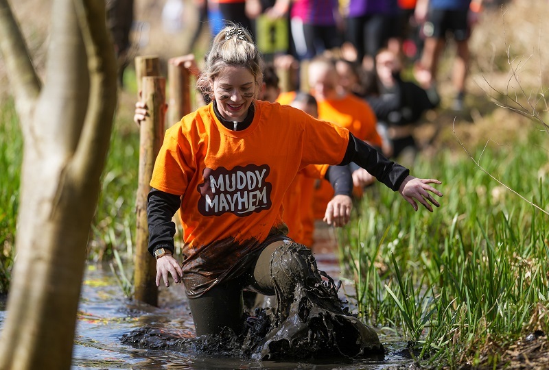 participant-wades-through-thigh-high-mud-at-muddy-mayhem