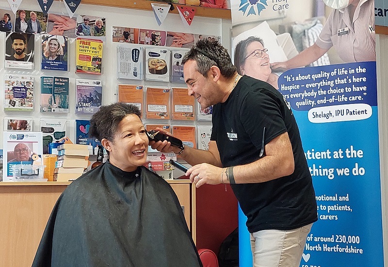 barber-smiles-as-he-shaves-first-piece-of-altheas-hair