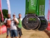 cotswold-way-ultra-challenge-finishers-medals-held-up-at-the-finish-line